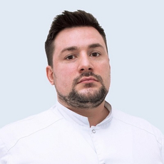 Турков Евгений Жанович, имплантолог